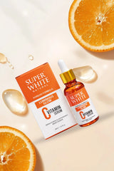 Super White Natural Vitamin C serum bottle and box with fresh orange slices for a bright skincare aesthetic